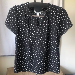 Black blouse with white polkadots
